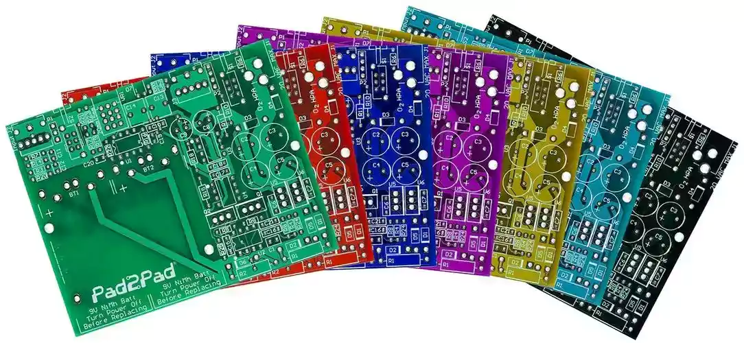 PCB lineup showing multiple solder-mask colors including purple