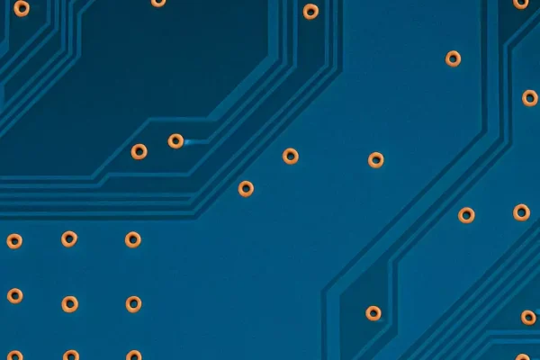 Close-up of FR-4 PCB with copper traces and vias